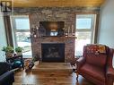 56 Sukunka Place, Tumbler Ridge, BC  - Indoor Photo Showing Living Room With Fireplace 