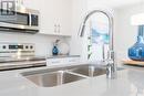 2328 Saunders Crescent, Regina, SK  - Indoor Photo Showing Kitchen With Double Sink 