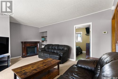 402 Blenkhorn Street, Vibank, SK - Indoor Photo Showing Living Room With Fireplace