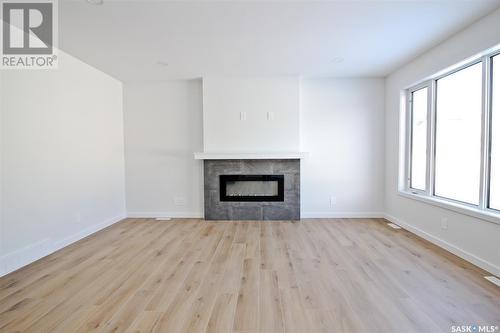 170 Schmeiser Lane, Saskatoon, SK - Indoor Photo Showing Living Room With Fireplace