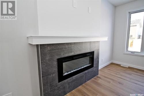 170 Schmeiser Lane, Saskatoon, SK - Indoor Photo Showing Living Room With Fireplace