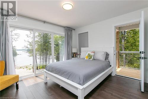 bedroom 2 with access to upper deck - 277 Eagle Road, Tobermory, ON - Indoor Photo Showing Bedroom