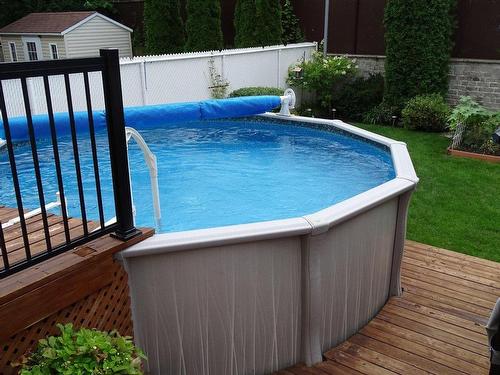Pool - 1085 Av. Marc-Aurèle-Fortin, Laval (Sainte-Rose), QC - Outdoor With Above Ground Pool With Backyard