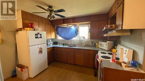 107 Main Street, Lanigan, SK - Indoor Photo Showing Kitchen With Double Sink