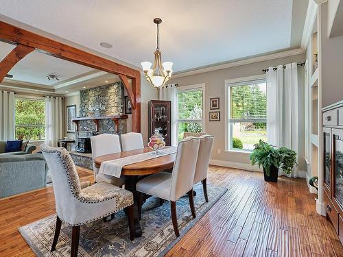990 Matuka Dr, Nanoose Bay, BC - Indoor Photo Showing Dining Room With Fireplace