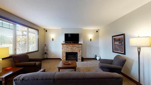 614 B - 600 Bighorn Boulevard, Radium Hot Springs, BC - Indoor Photo Showing Living Room With Fireplace