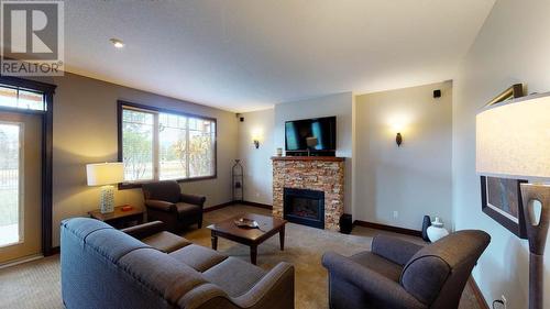 600 Bighorn Boulevard Unit# 614 B, Radium Hot Springs, BC - Indoor Photo Showing Living Room With Fireplace