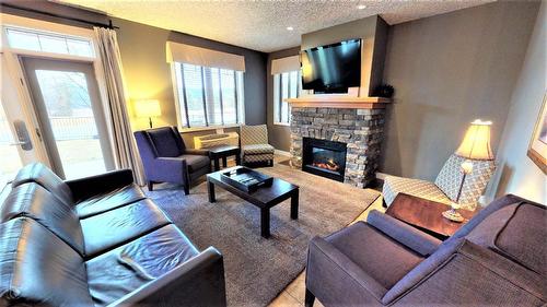 416 K2 - 400 Bighorn Boulevard, Radium Hot Springs, BC - Indoor Photo Showing Living Room With Fireplace