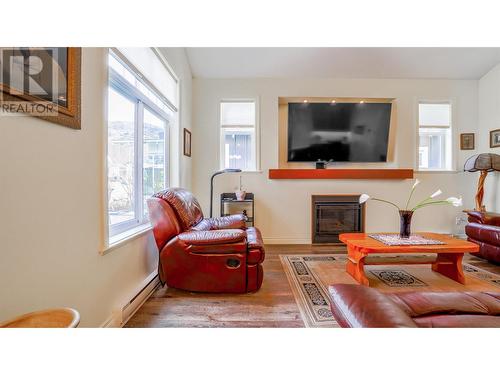 2450 Radio Tower Road Unit# 007, Oliver, BC - Indoor Photo Showing Living Room With Fireplace