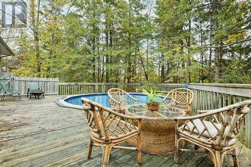 119 Scotch Pine Grove, Dunrobin, ON - Outdoor With Above Ground Pool With Deck Patio Veranda