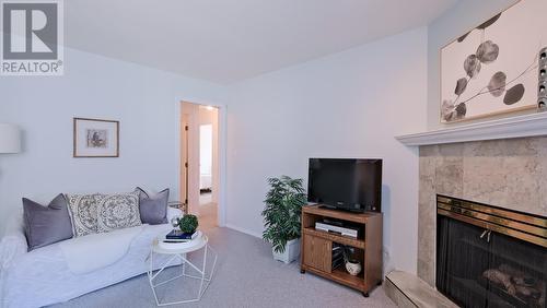 1634 Carmi Avenue Unit# 120, Penticton, BC - Indoor Photo Showing Living Room With Fireplace