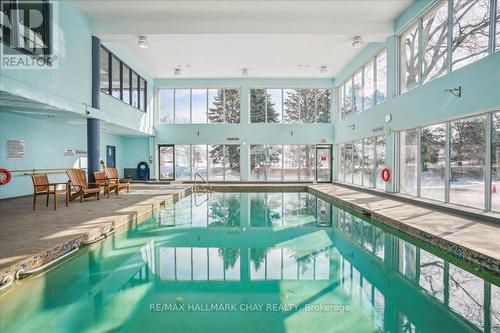 #203 -65 Ellen St, Barrie, ON - Indoor Photo Showing Other Room With In Ground Pool