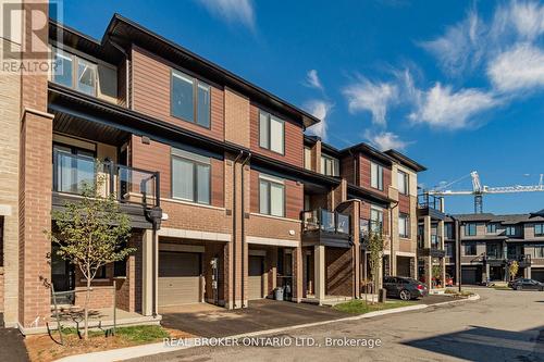 106 - 590 North Service Road N, Hamilton, ON - Outdoor With Balcony With Facade