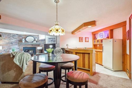 199 Penn Drive, Burlington, ON - Indoor Photo Showing Dining Room With Fireplace