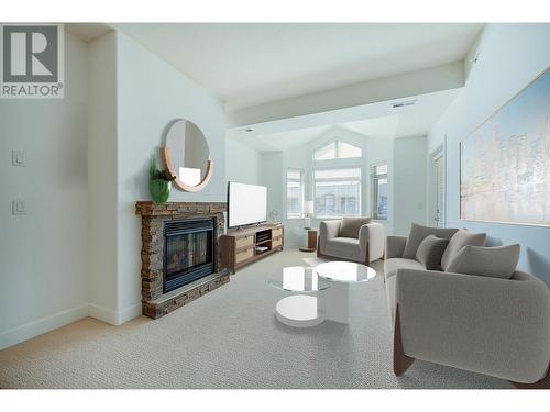 3996 Beach Avenue Unit# 313, Peachland, BC - Indoor Photo Showing Living Room With Fireplace
