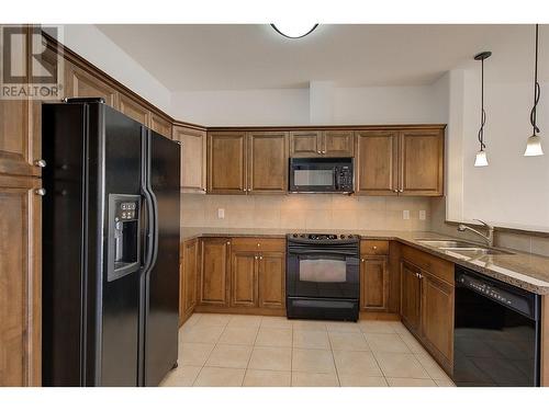 3996 Beach Avenue Unit# 313, Peachland, BC - Indoor Photo Showing Kitchen With Double Sink