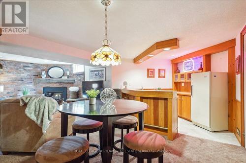 199 Penn Dr, Burlington, ON - Indoor Photo Showing Dining Room With Fireplace