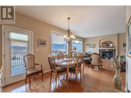 11908 La Costa Lane, Osoyoos, BC - Indoor Photo Showing Dining Room With Fireplace
