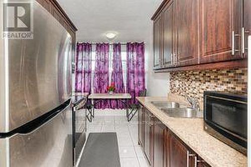 #204 -15 Kensington Rd, Brampton, ON - Indoor Photo Showing Kitchen With Double Sink