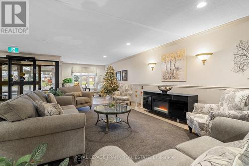 #112 -2 Heritage Way, Kawartha Lakes, ON - Indoor Photo Showing Living Room With Fireplace