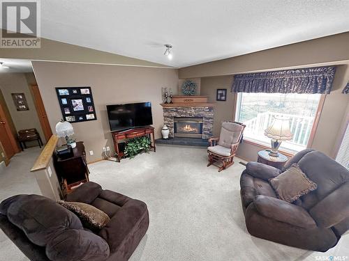 114 202 Lister Kaye Crescent, Swift Current, SK - Indoor Photo Showing Living Room With Fireplace