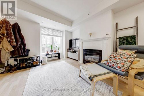679 - 3 Everson Drive, Toronto, ON - Indoor Photo Showing Living Room With Fireplace