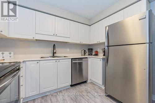 #103 -245 Queen St W, Centre Wellington, ON - Indoor Photo Showing Kitchen With Double Sink