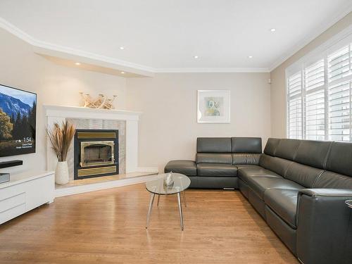 Salle familiale - 92 Rue Macdonald, Kirkland, QC - Indoor Photo Showing Living Room With Fireplace