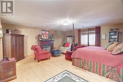 186 Milky Way Drive, Hanwell, NB - Indoor Photo Showing Bedroom With Fireplace