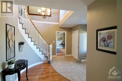 Spacious foyer with curved staircase - 