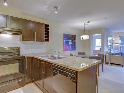 107-1089 Sunset Drive, Kelowna, BC - Indoor Photo Showing Kitchen With Double Sink