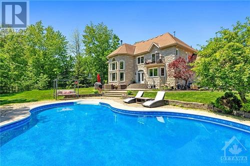 5818 Queenscourt Crescent, Ottawa, ON - Outdoor With In Ground Pool With Backyard