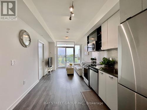#607 -10 De Boers Dr, Toronto, ON - Indoor Photo Showing Kitchen With Stainless Steel Kitchen With Upgraded Kitchen