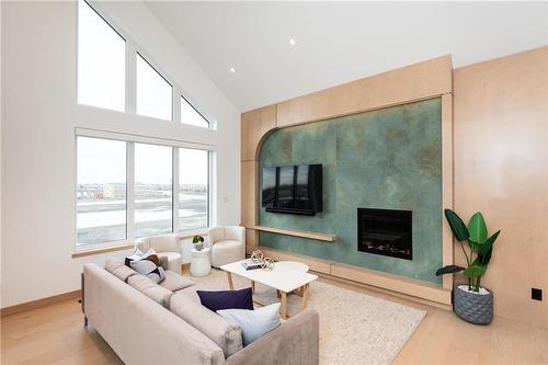 216 Butterfly Way, Winnipeg, MB - Indoor Photo Showing Living Room With Fireplace