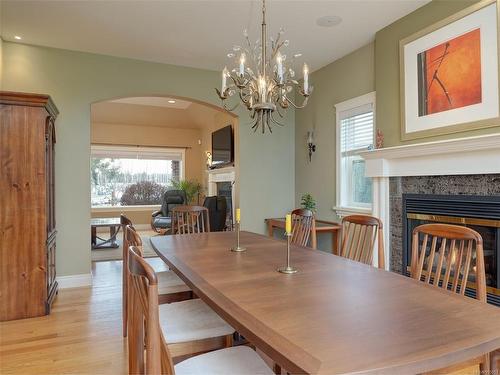1935 Marina Way, North Saanich, BC - Indoor Photo Showing Dining Room With Fireplace