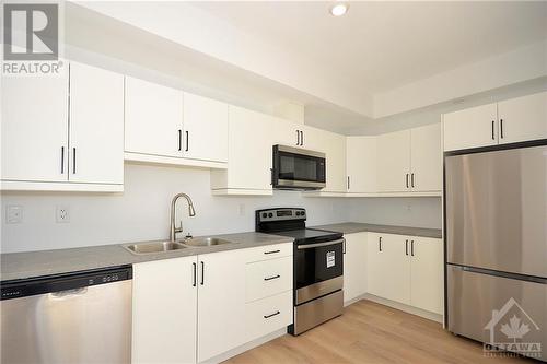 7 Maple Avenue Unit#306, Smiths Falls, ON - Indoor Photo Showing Kitchen With Double Sink