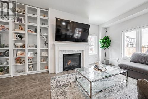 #173 -30 Times Square Blvd, Hamilton, ON - Indoor Photo Showing Living Room With Fireplace