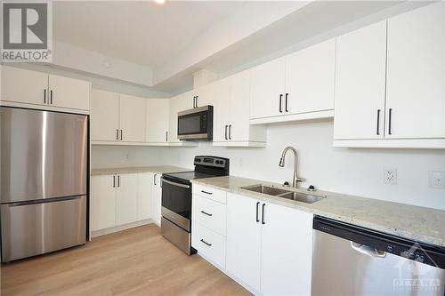 7 Maple Avenue Unit#302, Smiths Falls, ON - Indoor Photo Showing Kitchen With Double Sink