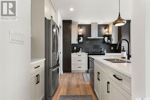 3021 Bellegarde Crescent, Regina, SK - Indoor Photo Showing Kitchen With Double Sink