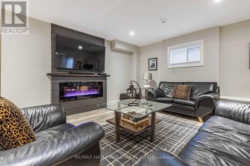 17 Black Creek Tr, Springwater, ON - Indoor Photo Showing Living Room With Fireplace