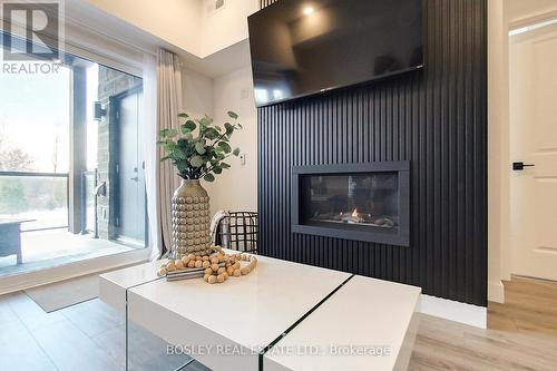 #104 -12 Beausoleil Lane, Blue Mountains, ON - Indoor Photo Showing Other Room With Fireplace