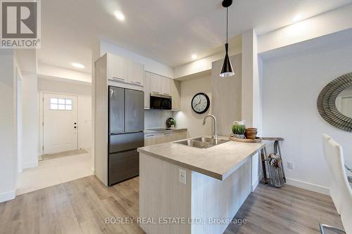 #104 -12 Beausoleil Lane, Blue Mountains, ON - Indoor Photo Showing Kitchen With Double Sink