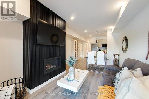 #104 -12 Beausoleil Lane, Blue Mountains, ON - Indoor Photo Showing Living Room With Fireplace