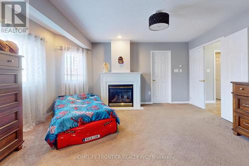 48 Patrick Drive, Barrie, ON - Indoor Photo Showing Bedroom With Fireplace