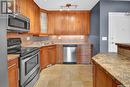 903 902 Spadina Crescent E, Saskatoon, SK  - Indoor Photo Showing Kitchen With Double Sink 