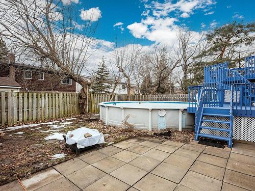 Backyard - 16 Rue Hazelwood, Dollard-Des-Ormeaux, QC - Outdoor With Above Ground Pool