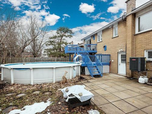 Backyard - 16 Rue Hazelwood, Dollard-Des-Ormeaux, QC - Outdoor With Above Ground Pool
