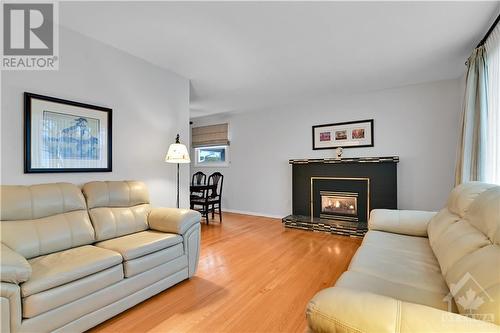LIVING | hardwood floor, cozy gas fireplace - 1417 Duford Drive, Orleans, ON - Indoor Photo Showing Living Room With Fireplace
