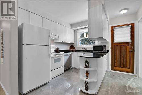 KITCHEN | convenient dishwasher, door opens to patio & private back yard - 1417 Duford Drive, Orleans, ON - Indoor Photo Showing Kitchen