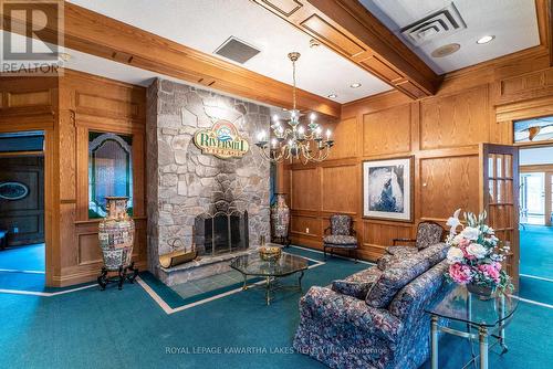 4E - 40 Rivermill Boulevard, Kawartha Lakes, ON - Indoor Photo Showing Other Room With Fireplace